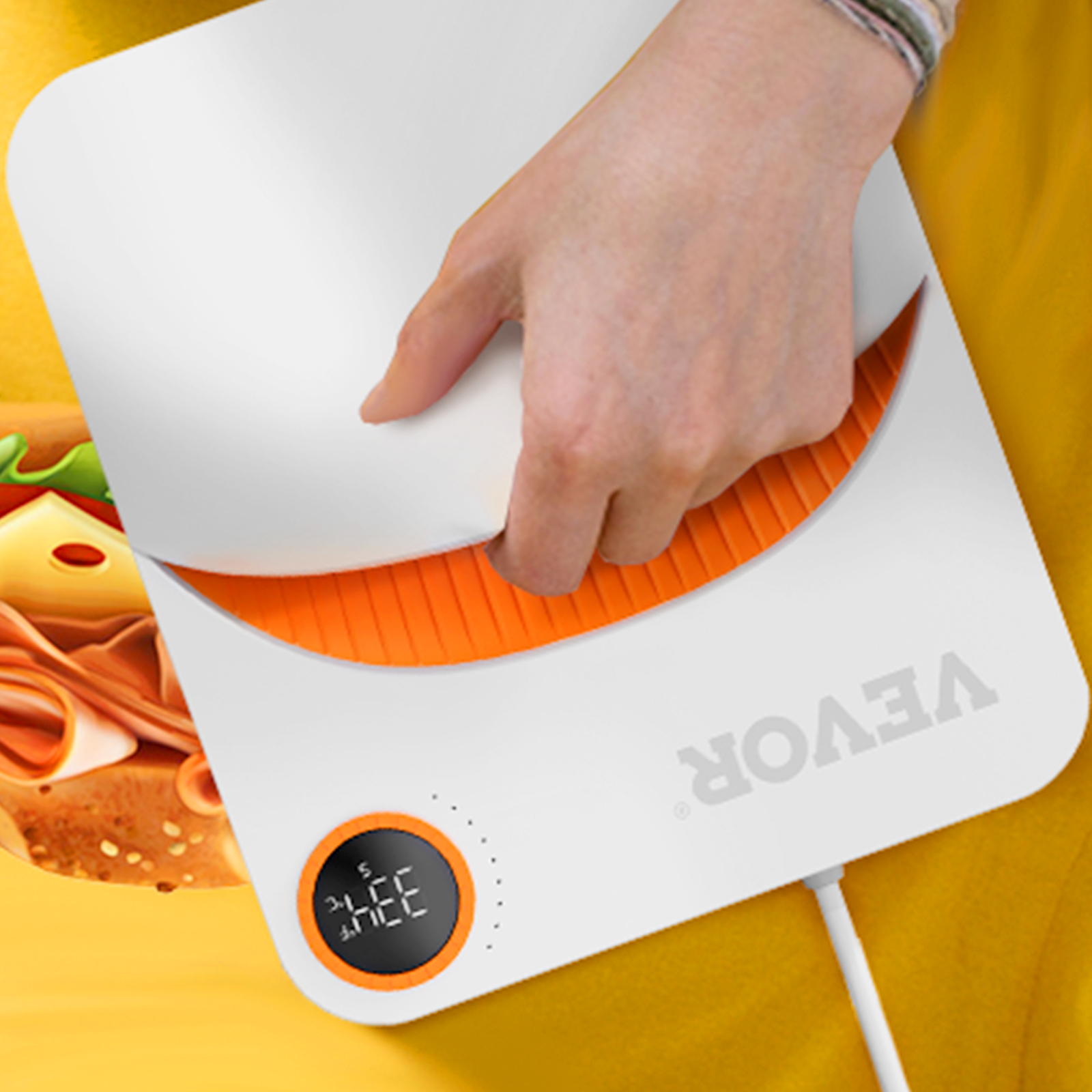 ręcznie za pomocą prasy termicznej VEVOR na żółtym materiale z nadrukowanym wzorem kanapkowym.